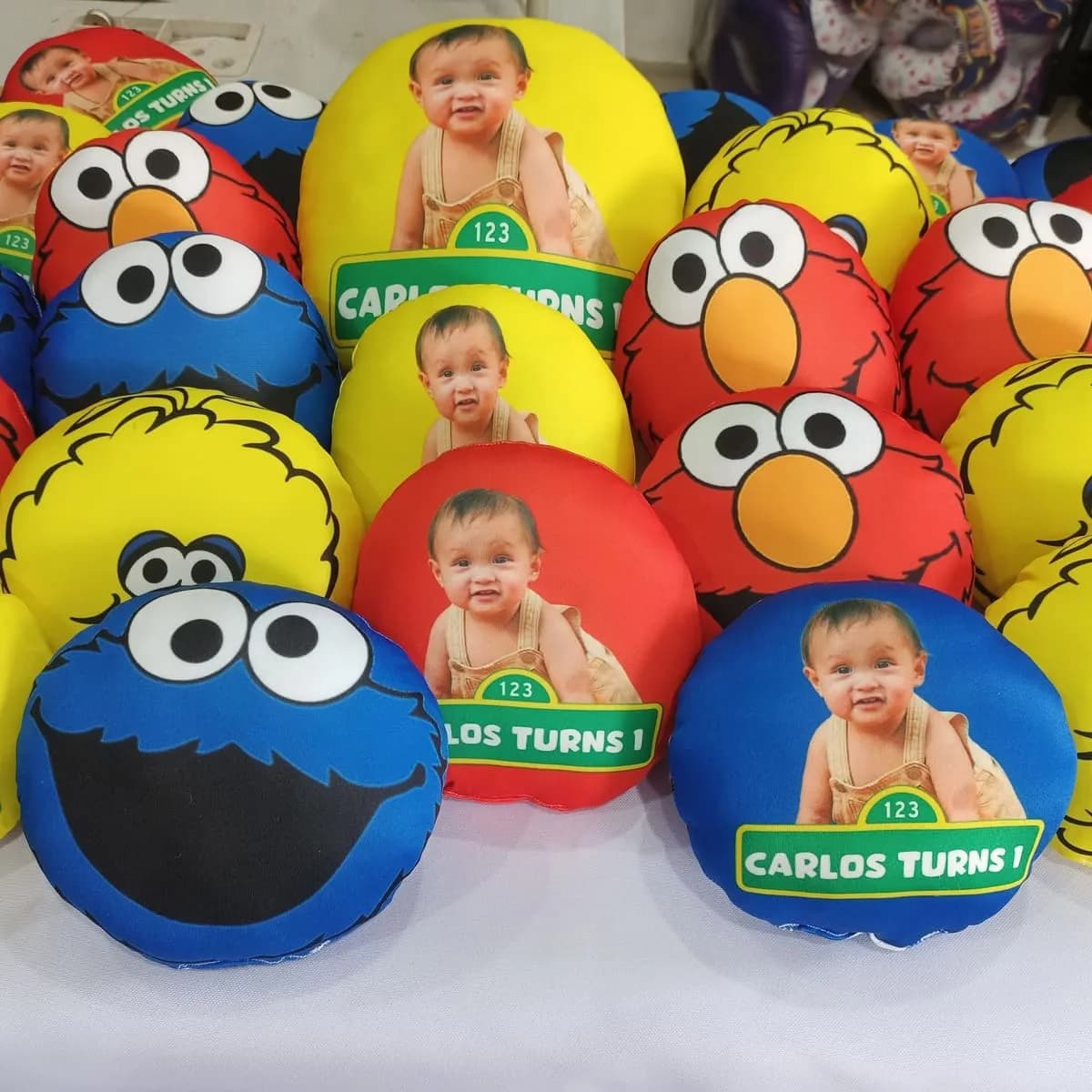 Sesame Street themed plush party favors arranged in a grid